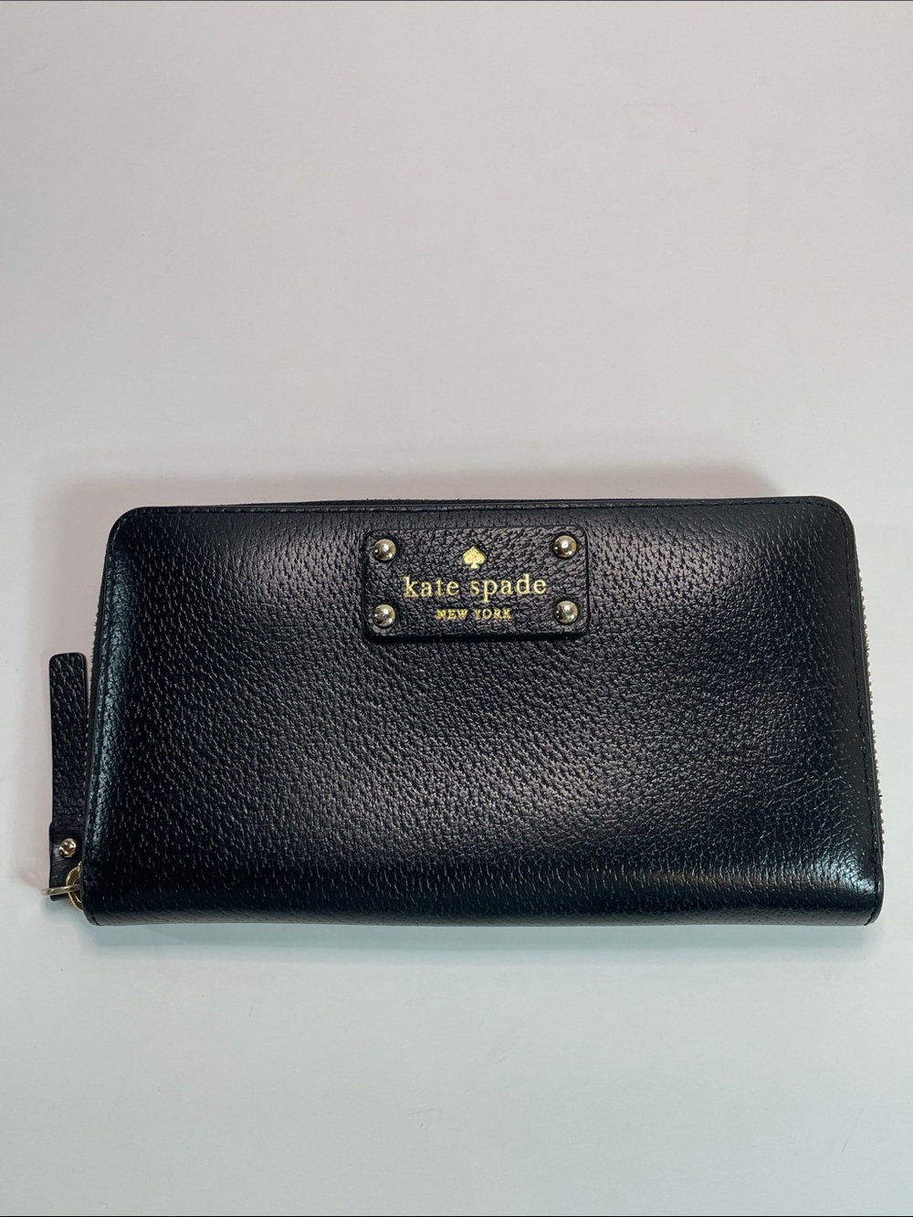 kate spade black pebbled leather zip-around wallet with gold logo